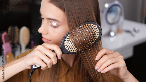 woman combing her hair