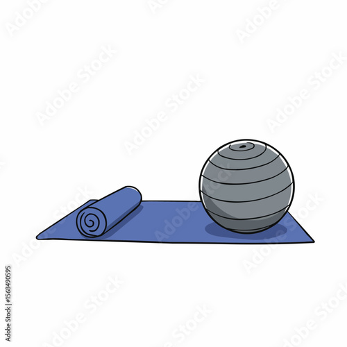 Exercise ball on blue yoga mat for fitness and stretching  