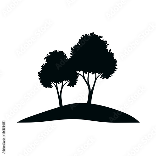 A silhouette of two trees stands gracefully upon a small mound, evoking a sense of nature's serene beauty and timeless appeal.