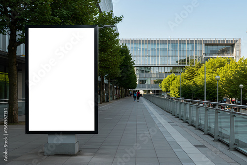 Mockup empty white advertising placed at side of city path. Outdoor advertisement template poster for urban commercial marketing campaigns. Selective focus
