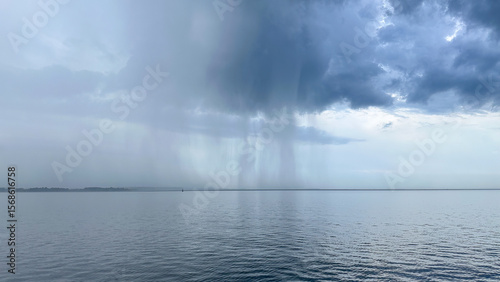 A sheet of rain coming down over the waters of the Chesapeake Bay