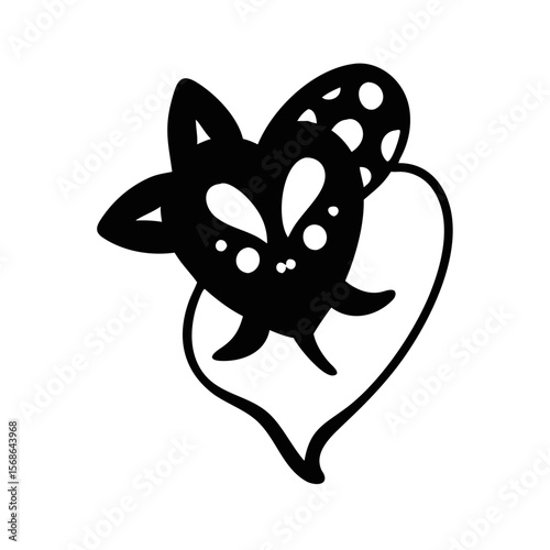 Stylized heart shaped creature with catlike features and spotted wing design