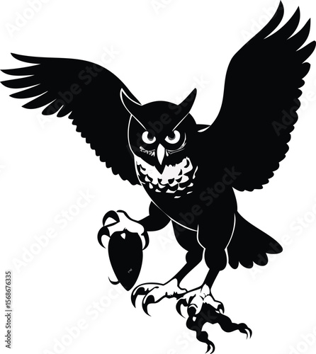 A great horned owl clutching its prey, displaying its powerful talons.