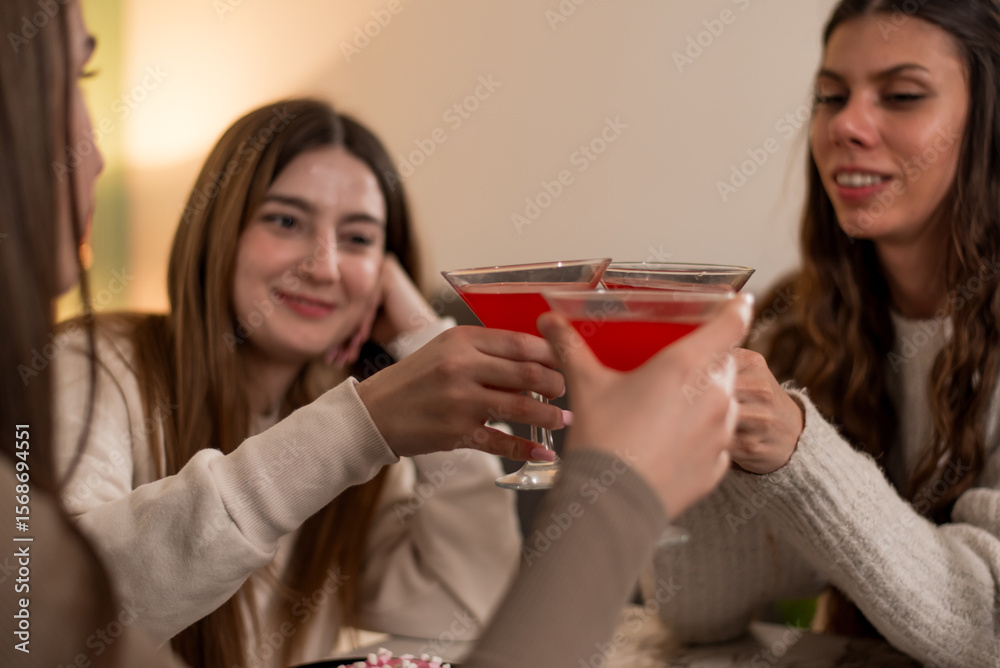 Group of friends enjoying red cocktails together in a cozy setting Group of friends enjoying red cocktails together in a cozy setting