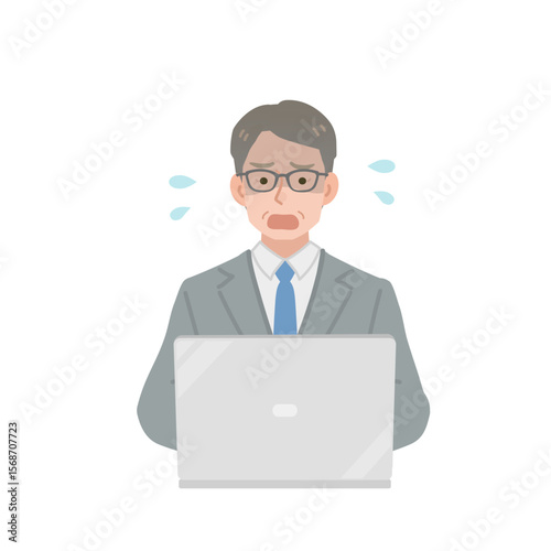 パソコン画面を見て焦る中年の会社員