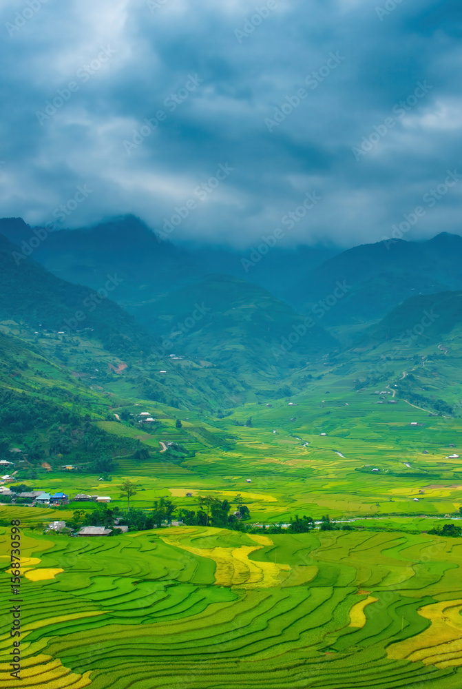 Obraz premium Vertical Beautiful Mountain landscape foggy windy mountain range green landscape asian farm. Vertical Amazing Landscape mountain green field meadow white cloud blue sky sunrise. Countryside scenery