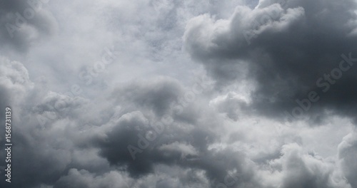 Fototapeta Dark rain cloud dramatic sky summer tropical thunder storm sky and fluffy black darkness cloud nearly raining cloudscape