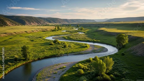 Serpentine River Winding Through Lush Green Valley Landscape