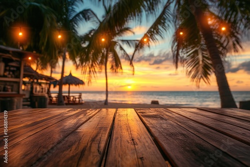 Wooden table on a beach at sunset.