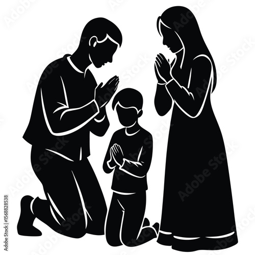 Family of three praying together on their knees in silhouette