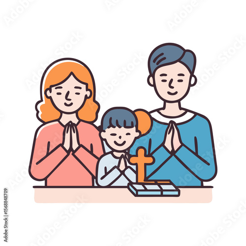 Family praying together at table with Bible and cross