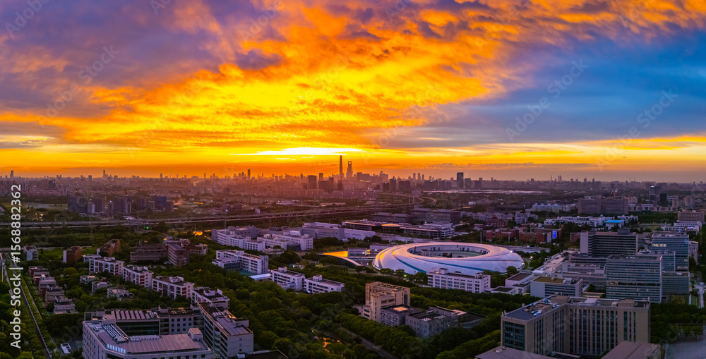 Fototapeta premium Panoramic aerial view of Shanghai Zhangjiang Hi Tech Development Zone at sunset, with beautiful flame clouds.