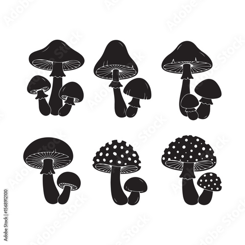 Six Black Silhouettes of Mushrooms Various Sizes and Styles Some with White Spots on Caps Set Against White Background