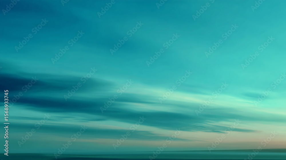 Fototapeta premium An ethereal turquoise sky evokes a feeling of tranquility and peace at the tranquil dawn horizon.