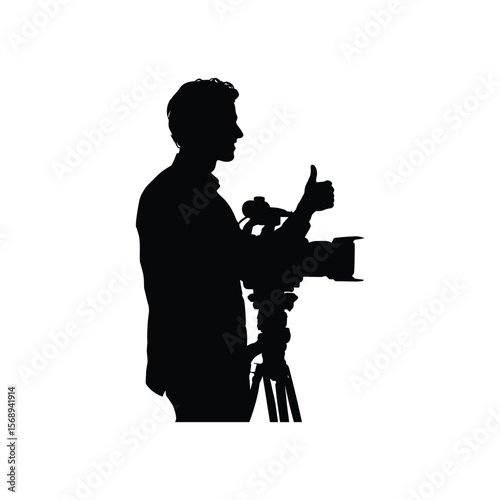Silhouette of Cameraman Holding Video Camera