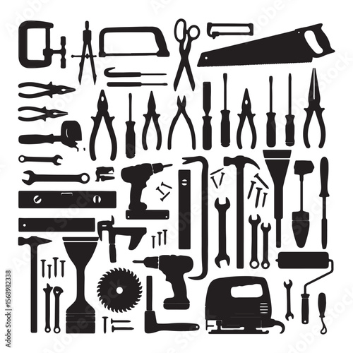Various black workshop tools and hardware arranged in a pattern construction