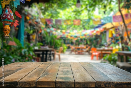 Wooden table top in vibrant outdoor cafe