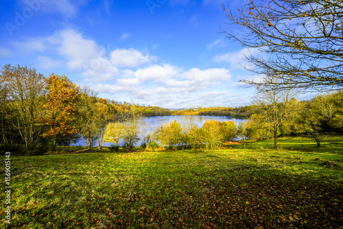 View of the Weinfelder Maar and the surrounding landscape. Nature in the Eifel region in autumn. Totenmaar near Daun.
