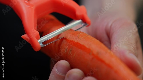 Knife for peeling vegetables.
A chef uses a vegetable peeler to peel a carrot before cooking.
A sharp knife for cutting vegetables.