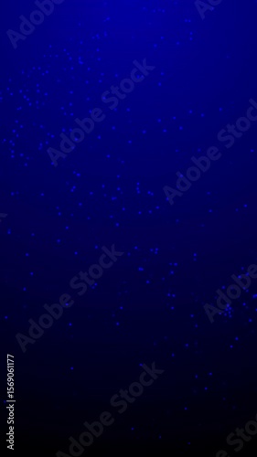 Blue tiny lights on a dark blue background. Perfect for holiday and festive designs, technology concepts, or abstract backgrounds.