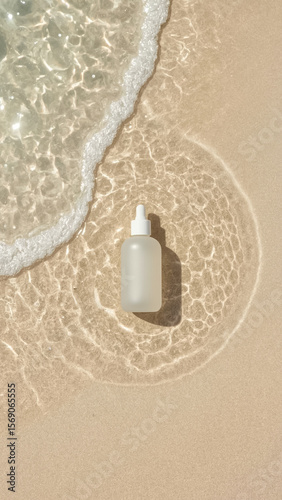 Minimalist skincare dropper bottle on wet sand with sunlight and sea wave. Clean, tropical flat lay with natural ripple reflections.

