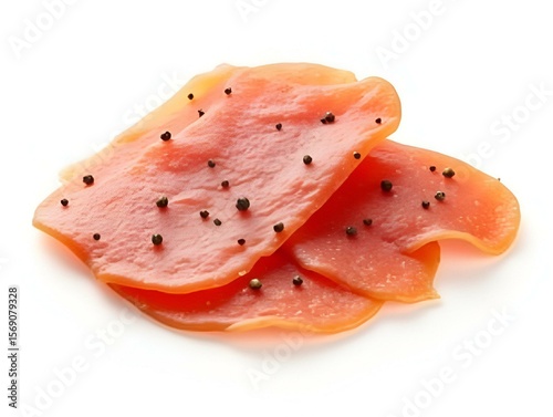 Slices of seasoned lardo or salo with peppercorn coating, isolated on white transparent background, concept of premium cured meat