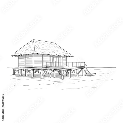 Wooden beach house on stilts over calm water with thatched roof  