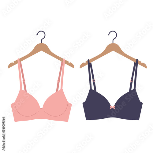 Two bras hanging on wooden hangers in pink and dark blue colors  