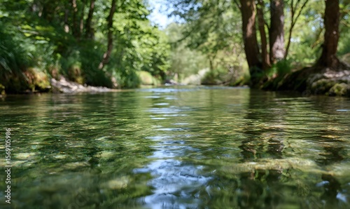 The clear water of the river reflects the green trees, creating beautiful ripples on its surface, Generative AI