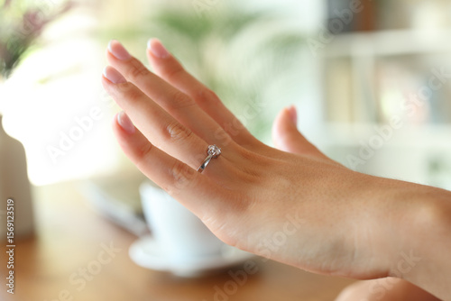 Wallpaper Mural Closeup of woman hand showing engagement ring at home Torontodigital.ca