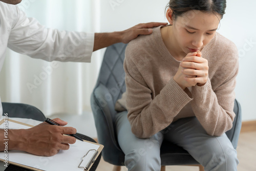 psychiatrist holds shoulders while discussing life and family issues. doctor encourages and empathy woman suffers depression. psychological, save divorce, Hand in hand together, trust, care