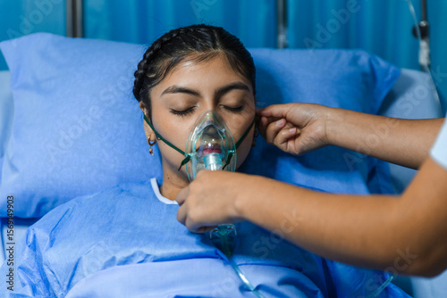 Patient receiving care with an air mask in a hospital setting photo