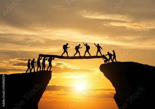 Team bridging gap between cliffs at sunset with teamwork