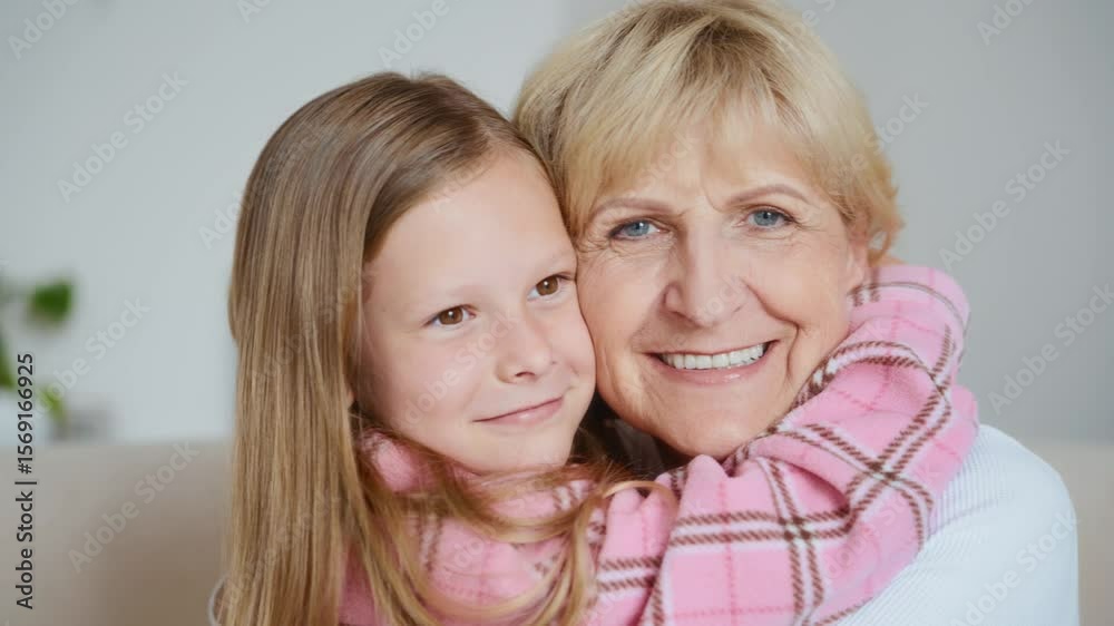 Close-up shot of a joyful embrace between a smiling grandmother and her affectionate granddaughter. Natural light and real emotion make the moment deeply relatable and touching. High quality 4k Close-up shot of a joyful embrace between a smiling grandmother and her affectionate granddaughter. Natural light and real emotion make the moment deeply relatable and touching. High quality 4k
