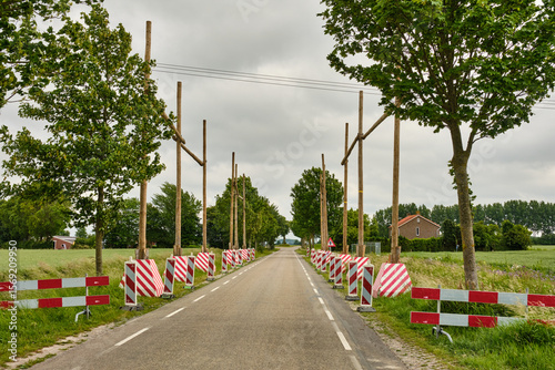High voltage line construction with wooden traffic protection in Zeeland