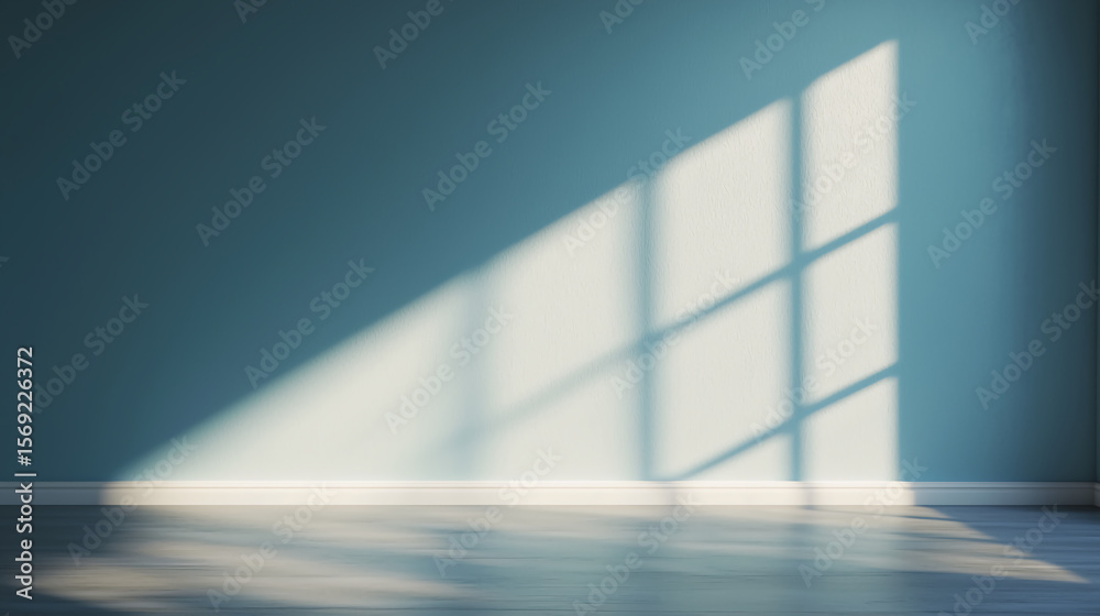 Sunlight casts a grid shadow through a window onto a smooth floor and teal wall in an empty, minimalist room. Sunlight casts a grid shadow through a window onto a smooth floor and teal wall in an empty, minimalist room.
