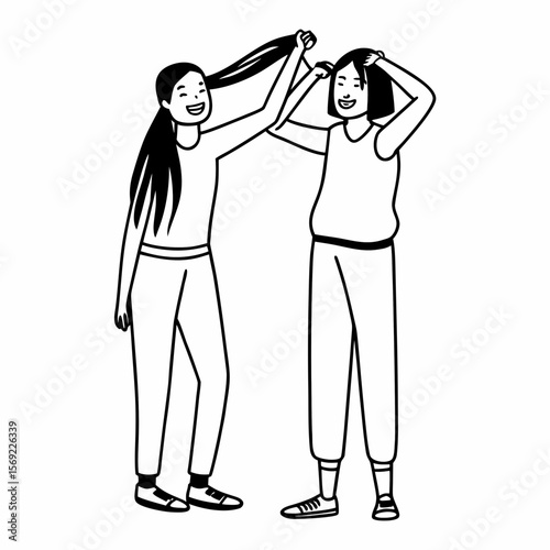 Funny best friends laughing cheerfully while standing together in a studio