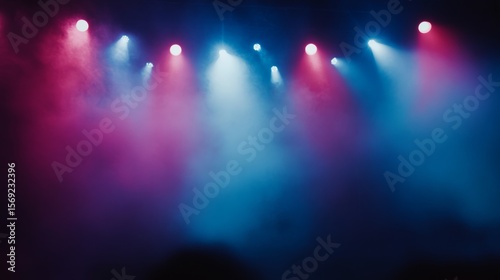 Vibrant concert stage with multicolored lighting beams and mist creating dynamic color transitions and energetic bokeh effects, capturing an electrifying live music atmosphere