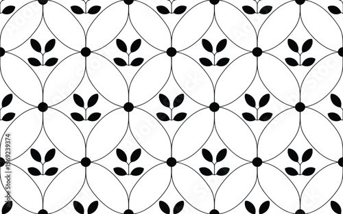 Black and white floral pattern with leaf motifs and circular design