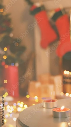 Animation of two champagne flutes, christmas tree decorations