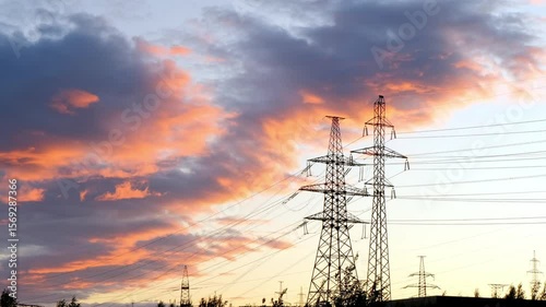 A breathtakingly beautiful dramatic sunset intertwined with the silhouettes of power lines