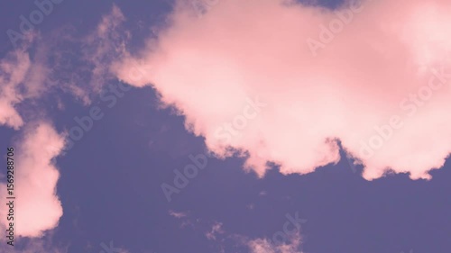 Time Lapse Sunny Blue Lilac Sunset Sky with Cotton Puffy Pink Coral Clouds, Motion. Pink Cumulus Clouds on a Blue Purple Skyscraper at Sunset in Sunlight. Beautiful Background 4K, Heaven, Atmosphere.
