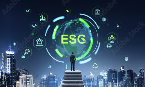 Businessman looking at ESG digital interface with sustainability
