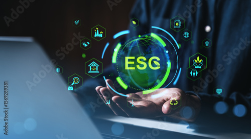 ESG concept with digital sustainability icons hovering above hands near laptop in futuristic eco-technology business interface scene on dark background.