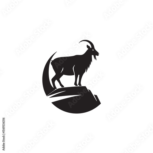 A goat standing on a mountain cliff, in a black silhouette.