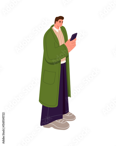 Person with phone addiction texting, scrolls social networks. Sad man in coat stands, holds, uses smartphone. Upset character looks at telephone screen. Flat isolated vector illustration on white