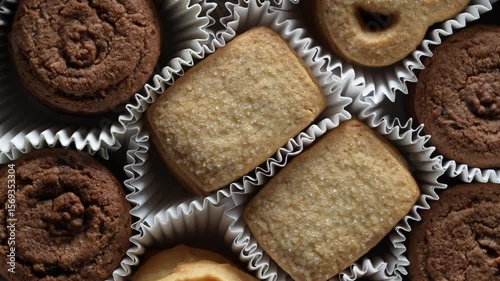 Crispy crumbly shortbread cookies in box, top view, close up, rotates