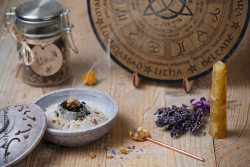 Schilderij op canvas Incense ritual with frankincense, resins and dried herbs at Litha festival in wa