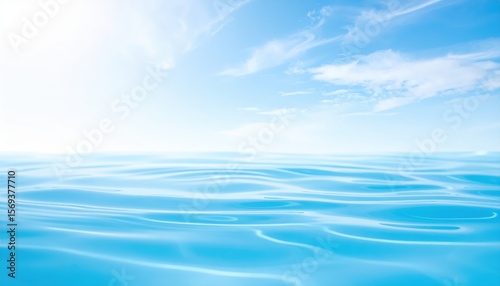 Serene Seascape: Calm ocean waves gently ripple under a bright, sunny sky, evoking a sense of tranquility and peace. 