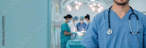 A close-up of a male doctor with a stethoscope against a medical team performing surgery in an operating room.  Concept of human medical health. Banner with copy space area.